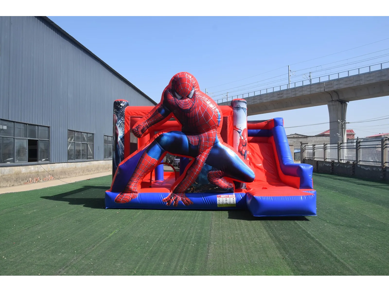 Springkussen Spiderman met glijbaan